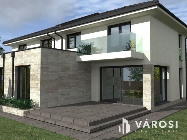 Tágas ,napfényes ikerház családbarát környéken eladó